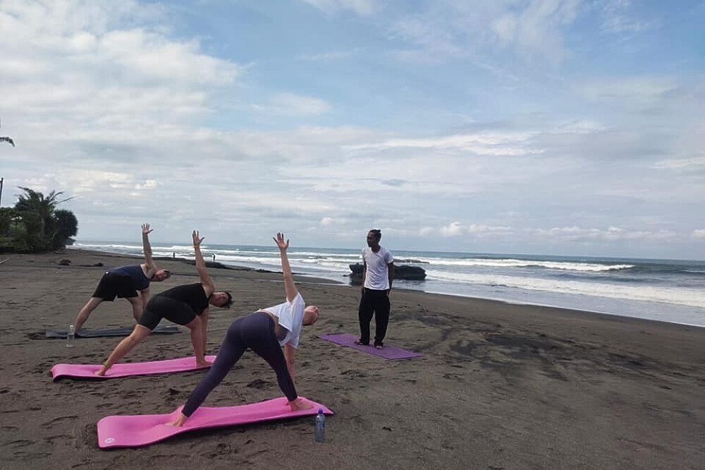 Yoga class on the beach